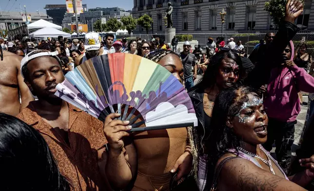 Revelers dance to the music at the hip-hop stage during pride celebrations at Civic Center in San Francisco, Saturday, June 29, 2024. (Stephen Lam/San Francisco Chronicle via AP)