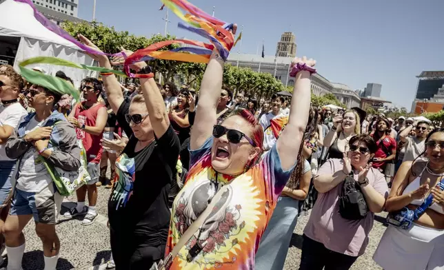 Christy Gorbet, of Pleasanton, center, dances in front of the main stage during the first of two days of Pride Celebration at Civic Center in San Francisco, Saturday, June 29, 2024. (Stephen Lam/San Francisco Chronicle via AP)