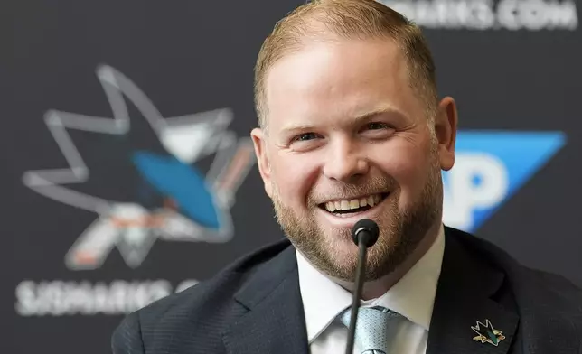 Ryan Warsofsky speaks at a news conference where he was introduced as the NHL hockey head coach of the San Jose Sharks in San Jose, Calif., Monday, June 17, 2024. (AP Photo/Jeff Chiu)