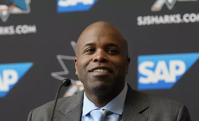 San Jose Sharks general manager Mike Grier speaks at a news conference introducing Ryan Warsofsky as the NHL hockey head coach of the San Jose Sharks in San Jose, Calif., Monday, June 17, 2024. (AP Photo/Jeff Chiu)