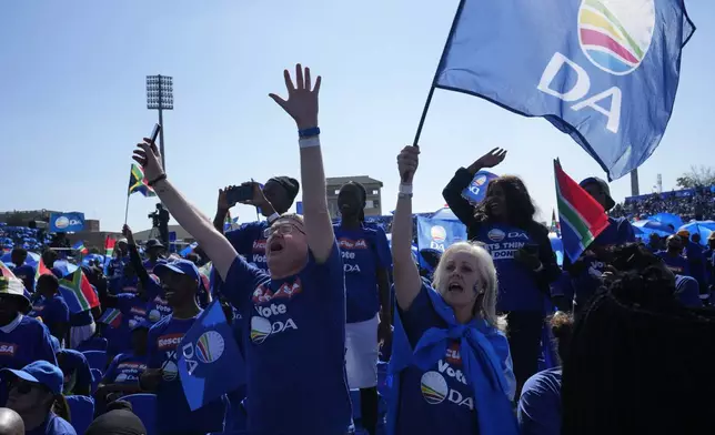 FILE - Supporters of the main opposition Democratic Alliance (DA) party attend a final election rally, in Benoni, South Africa, on May 26, 2024. In a country where racial segregation was once brutally enforced, South Africa's new coalition government has brought a Black president and a white opposition leader together in what is on the face of it a picture of unity. (AP Photo/Themba Hadebe, File)