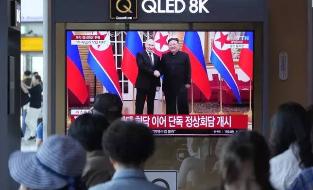A TV screen shows an image of North Korean leader Kim Jong Un, right, and Russian President Vladimir Putin during a news program, at the Seoul Railway Station in Seoul, South Korea, Wednesday, June 19, 2024. North Korean leader Kim promised full support for Russia's war in Ukraine before beginning a one-on-one meeting with Russian President Putin in Pyongyang on Wednesday, in a bid to expand their economic and military cooperation and show a united front against Washington. (AP Photo/Ahn Young-joon)