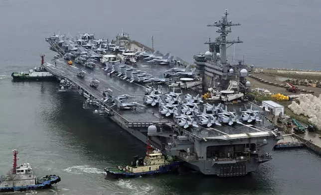 The Theodore Roosevelt (CVN 71), a nuclear-powered aircraft carrier is anchored in Busan, South Korea, Saturday, June 22, 2024. (Song Kyung-Seok/Pool Photo via AP)