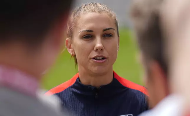 United States national women's soccer team player Alex Morgan talks to reporters before a practice to prepare for a friendly match against South Korea, Friday, May 31, 2024, in Commerce City, Colo. (AP Photo/David Zalubowski)