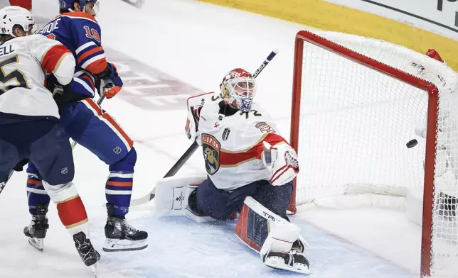 Florida Panthers goalie Sergei Bobrovsky (72) gives up a goal to Edmonton Oilers' Adam Henrique (19) during the first period of Game 4 of the NHL hockey Stanley Cup Final, Saturday, June 15, 2024, in Edmonton, Alberta. (Jeff McIntosh/The Canadian Press via AP)