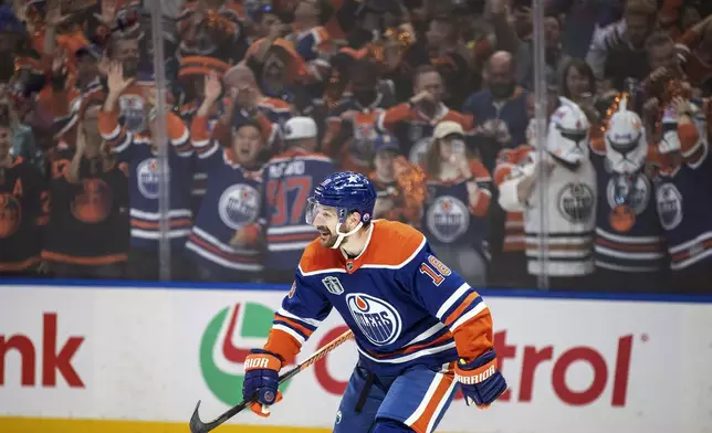 Edmonton Oilers' Zach Hyman (18) celebrates a goal against the Florida Panthers during the second period of Game 6 of the NHL hockey Stanley Cup Final, Friday, June 21, 2024, in Edmonton, Alberta. (Jason Franson/The Canadian Press via AP)