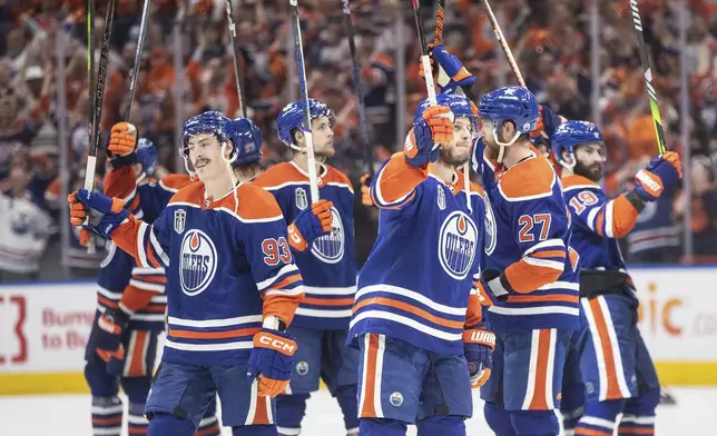 Edmonton Oilers celebrate a win over the Florida Panthers in Game 6 of the NHL hockey Stanley Cup Final, Friday, June 21, 2024, in Edmonton, Alberta. The Oilers won 5-1 to tie the series. (Jason Franson/The Canadian Press via AP)