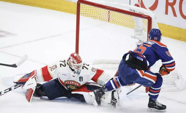 Florida Panthers goalie Sergei Bobrovsky (72) is scored on by Edmonton Oilers' Dylan Holloway (55) during the first period of Game 4 of the NHL hockey Stanley Cup Final, Saturday, June 15, 2024, in Edmonton, Alberta. (Jeff McIntosh/The Canadian Press via AP)