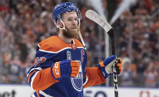 Edmonton Oilers' Connor McDavid celebrates the team's win over the Florida Panthers in Game 4 of the NHL hockey Stanley Cup Final, Saturday, June 15, 2024, in Edmonton, Alberta. (Jason Franson/The Canadian Press via AP)