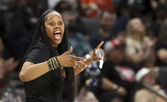 Seattle Storm coach Noelle Quinn calls out to players during the first half of the team's WNBA basketball game against the Las Vegas Aces on Wednesday, June 19, 2024, in Las Vegas. (Steve Marcus/Las Vegas Sun via AP)