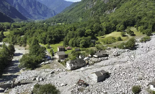 The Sorte village, community of Lostallo, in Southern Switzerland, is seen after a landslide, caused by the bad weather and heavy rain in the Misox valley, in Lostallo, Southern Switzerland, Saturday, June 22 2024. Massive thunderstorms and rainfall had led to a flooding situation on Friday evening after a landslide in the Misox valley. Four people went missing on Saturday morning. Several dozen people had to be evacuated from their homes in the Misox and Calanca regions. (Samuel Golay/Keystone via AP)