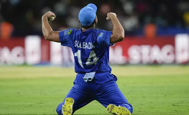 Afghanistan's Gulbadin Naib celebrates after defeating Australia by 21 runs in their men's T20 World Cup cricket match at Arnos Vale Ground, Kingstown, Saint Vincent and the Grenadines, Saturday, June 22, 2024. (AP Photo/Ramon Espinosa)
