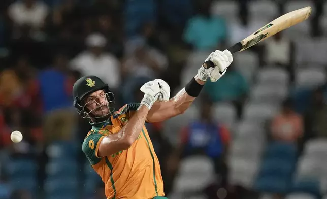 South Africa's captain Aiden Markram bats during the men's T20 World Cup semifinal cricket match between Afghanistan and South Africa at the Brian Lara Cricket Academy in Tarouba, Trinidad and Tabago, Wednesday, June 26, 2024. (AP Photo/Ricardo Mazalan)