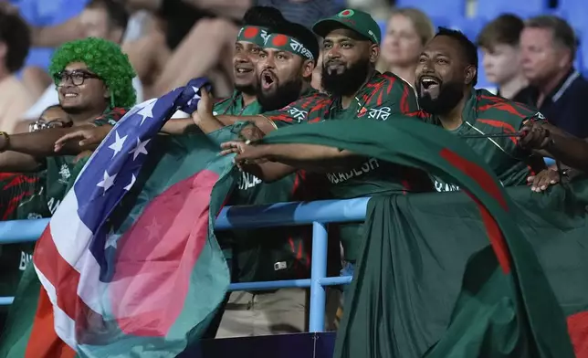 Bangladesh fans react during the ICC Men's T20 World Cup cricket match between Australia and Bangladesh in North Sound, Antigua and Barbuda, Thursday, June 20, 2024. (AP Photo/Lynne Sladky)