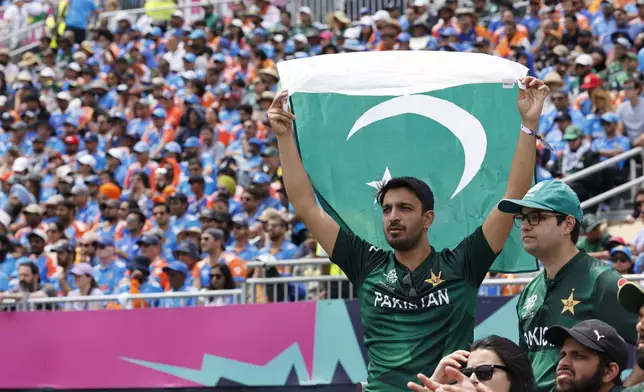 Pakistani supports cheers their team during the ICC Men's T20 World Cup cricket match between India and Pakistan at the Nassau County International Cricket Stadium in Westbury, New York, Sunday, June 9, 2024. (AP Photo/Stefan Jeremiah)