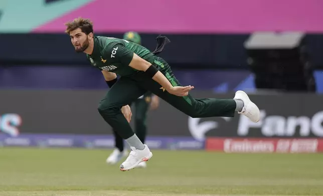 Pakistan's Shaheen Shah Afridi reacts after bowling a delivery during the ICC Men's T20 World Cup cricket match between India and Pakistan at the Nassau County International Cricket Stadium in Westbury, New York, Sunday, June 9, 2024. (AP Photo/Adam Hunger)