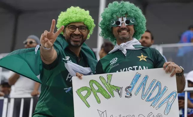 Pakistani supporters cheer for their team before the start of the ICC Men's T20 World Cup cricket match between India and Pakistan at the Nassau County International Cricket Stadium in Westbury, New York, Sunday, June 9, 2024. (AP Photo/Stefan Jeremiah)