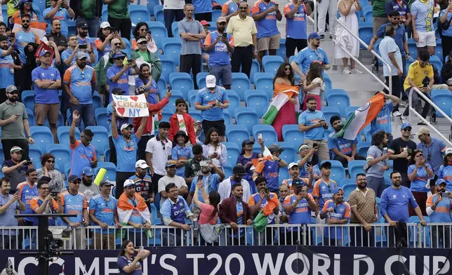 Fans wait for the start of the ICC Men's T20 World Cup cricket match between India and Pakistan at the Nassau County International Cricket Stadium in Westbury, New York, Sunday, June 9, 2024. (AP Photo/Adam Hunger)