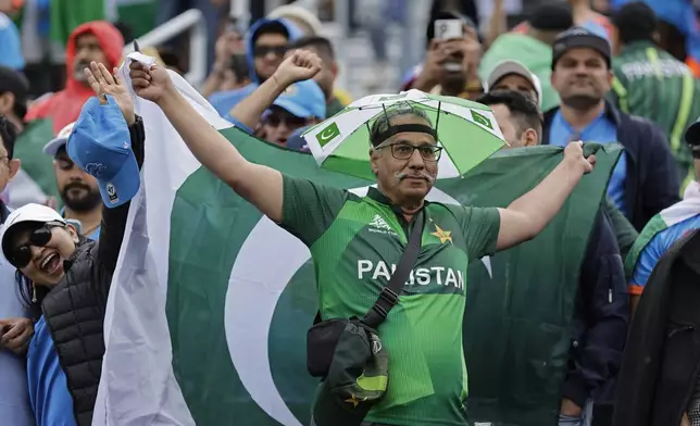 A Pakistan supporter reacts as he waits prior to the start of the ICC Men's T20 World Cup cricket match between India and Pakistan at the Nassau County International Cricket Stadium in Westbury, New York, Sunday, June 9, 2024. (AP Photo/Adam Hunger)