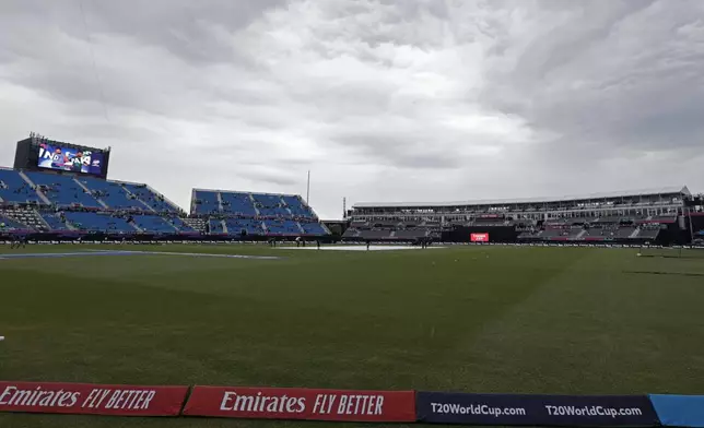 Clouds loom over as it drizzles prior to the start of the ICC Men's T20 World Cup cricket match between India and Pakistan at the Nassau County International Cricket Stadium in Westbury, New York, Sunday, June 9, 2024. (AP Photo/Adam Hunger)