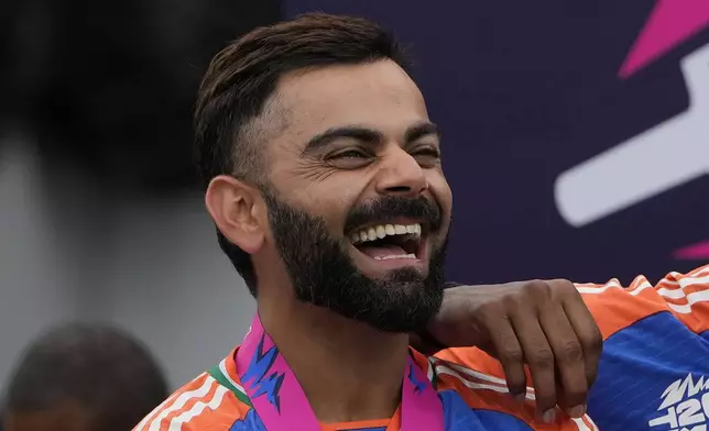 India's Virat Kohli shares a laugh with teammates at the presentation ceremony after defeating South Africa in the ICC Men's T20 World Cup final cricket match at Kensington Oval in Bridgetown, Barbados, Saturday, June 29, 2024. (AP Photo/Ricardo Mazalan)