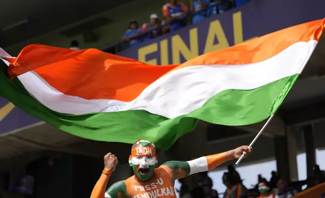 An Indian fan cheers for his team before the start of the ICC Men's T20 World Cup final cricket match between India and South Africa at Kensington Oval in Bridgetown, Barbados, Saturday, June 29, 2024. (AP Photo/Ricardo Mazalan)