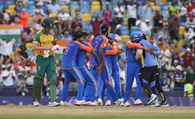 India's players celebrate their win against South Africa in the ICC Men's T20 World Cup final cricket match at Kensington Oval in Bridgetown, Barbados, Saturday, June 29, 2024. (AP Photo/Ramon Espinosa)