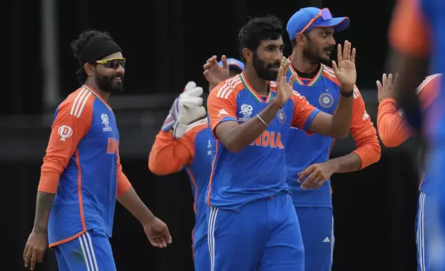 India's Jasprit Bumrah, center, celebrates with teammates after the dismissal of South Africa's Marco Jansen during the ICC Men's T20 World Cup final cricket match between India and South Africa at Kensington Oval in Bridgetown, Barbados, Saturday, June 29, 2024. (AP Photo/Ricardo Mazalan)