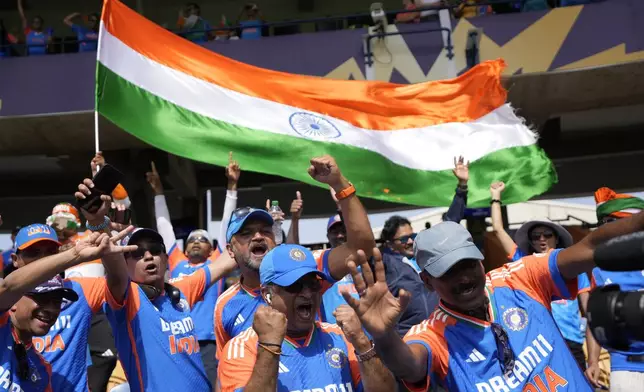 Indian supporters cheer for their team before the start of the ICC Men's T20 World Cup final cricket match between India and South Africa at Kensington Oval in Bridgetown, Barbados, Saturday, June 29, 2024. (AP Photo/Ricardo Mazalan)