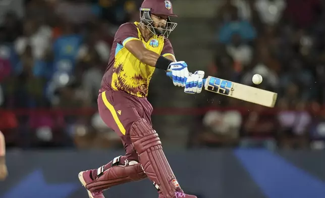 West Indies' Nicholas Pooran bats against Afghanistan during an ICC Men's T20 World Cup cricket match at Daren Sammy National Cricket Stadium in Gros Islet, Saint Lucia, Monday, June 17, 2024. (AP Photo/Ramon Espinosa)