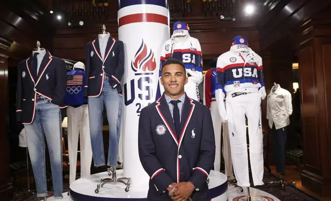 Olympic athlete in BMX racing, Kamren Larsen, models the Team USA Paris Olympics opening ceremony uniform at Ralph Lauren headquarters on Monday, June 17, 2024, in New York. (Photo by Charles Sykes/Invision/AP)