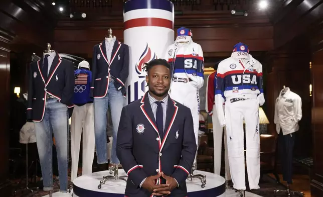 Olympic athlete in fencing, Daryl Homer, models the Team USA Paris Olympics opening ceremony uniform at Ralph Lauren headquarters on Monday, June 17, 2024, in New York. (Photo by Charles Sykes/Invision/AP)