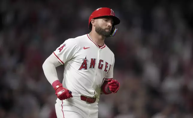 Los Angeles Angels' Kevin Pillar heads to first on a single that drove in the winning run against the Detroit Tigers during the 10th inning of a baseball game in Anaheim, Calif., Saturday, June 29, 2024. (AP Photo/Eric Thayer)