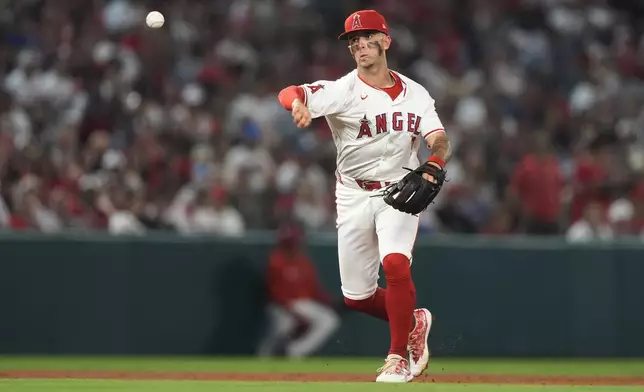 Los Angeles Angels shortstop Zach Neto throws out Detroit Tigers' Matt Vierling at first during the eighth inning of a baseball game Friday, June 28, 2024, in Anaheim, Calif. (AP Photo/Ryan Sun)