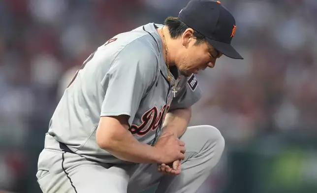 Detroit Tigers starting pitcher Kenta Maeda reacts after deflecting a line-drive single hit by Los Angeles Angels' Taylor Ward during the sixth inning of a baseball game, Friday, June 28, 2024, in Anaheim, Calif. (AP Photo/Ryan Sun)