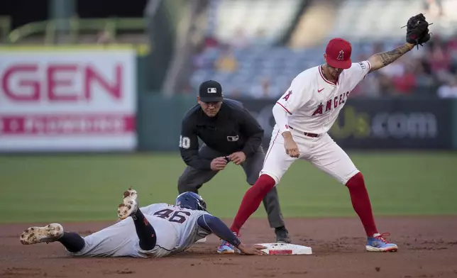 Detroit Tigers' Wenceel Perez (46) advances to second base as Los Angeles Angels shortstop Zach Neto catches the throw during the first inning of a baseball game in Anaheim, Calif., Saturday, June 29, 2024. (AP Photo/Eric Thayer)