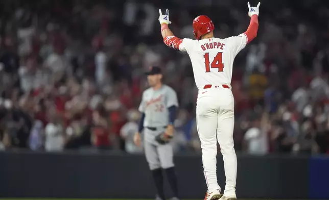 Los Angeles Angels' Logan O'Hoppe celebrates his go-ahead, three-run home run during the eighth inning of the team's baseball game against the Detroit Tigers, Friday, June 28, 2024, in Anaheim, Calif. (AP Photo/Ryan Sun)