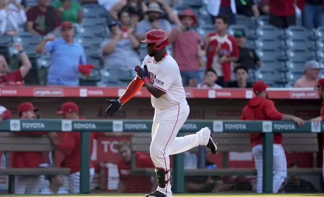 Los Angeles Angels' Miguel Sano gestures after hitting a solo home run against the Detroit Tigers during the second inning of a baseball game Thursday, June 27, 2024, in Anaheim, Calif. (AP Photo/Ryan Sun)