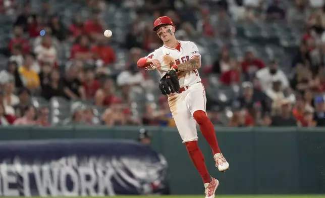 Los Angeles Angels shortstop Zach Neto throws out Detroit Tigers' Carson Kelly at first during the ninth inning of a baseball game, Thursday, June 27, 2024, in Anaheim, Calif. (AP Photo/Ryan Sun)