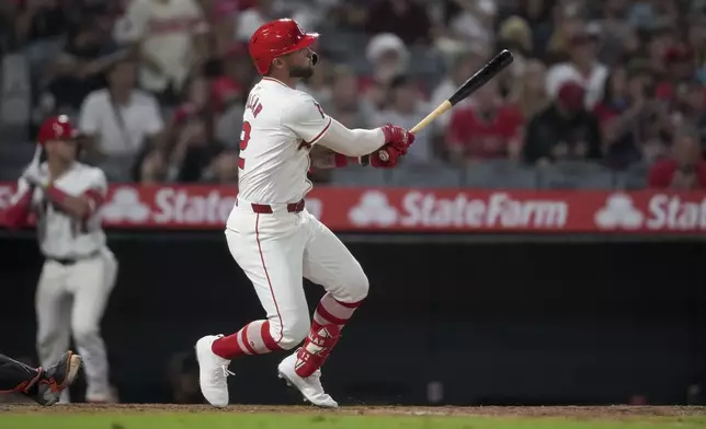 Los Angeles Angels' Kevin Pillar watches his single that drove in the winning run against the Detroit Tigers during the 10th inning of a baseball game in Anaheim, Calif., Saturday, June 29, 2024. (AP Photo/Eric Thayer)