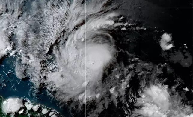 This National Oceanic and Atmospheric Administration satellite image taken at 4:50pm EDT shows hurricane Beryl as it strengthens over the Atlantic Ocean and churns toward the southeast Caribbean on Saturday, June 29, 2024. (NOAA via AP)