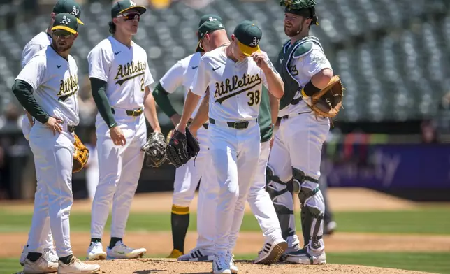 Oakland Athletics pitcher JP Sears (38) walks off the mound after leaving the game during the second inning of a baseball game against the Minnesota Twins in Oakland, Calif,. Saturday, June 22, 2024. (AP Photo/Nic Coury)