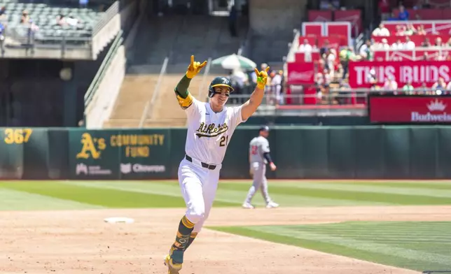 Oakland Athletics' Tyler Soderstrom (21) celebrates as he rounds third after hitting a home run during the second inning of a baseball game against the Minnesota Twins in Oakland, Calif,. Saturday, June 22, 2024. (AP Photo/Nic Coury)