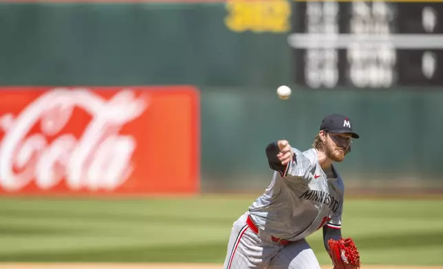 Minnesota Twins pitcher Bailey Ober (17) throws during the ninth inning of a baseball game against the Oakland Athletics in Oakland, Calif,. Saturday, June 22, 2024. (AP Photo/Nic Coury)
