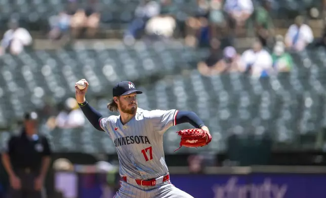 Minnesota Twins pitcher Bailey Ober (17) throws during the first inning of a baseball game against the Oakland Athletics in Oakland, Calif,. Satruday, June 22, 2024. (AP Photo/Nic Coury)