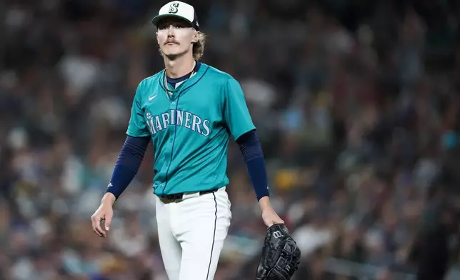 Seattle Mariners starting pitcher Bryce Miller walks to the dugout after facing the Minnesota Twins during the fourth inning of a baseball game Saturday, June 29, 2024, in Seattle. (AP Photo/Lindsey Wasson)