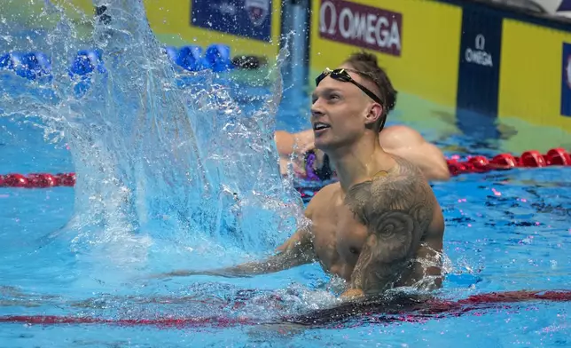 Caeleb Dressel reacts after winning the Men's 100 butterfly finals Saturday, June 22, 2024, at the US Swimming Olympic Trials in Indianapolis. (AP Photo/Darron Cummings)