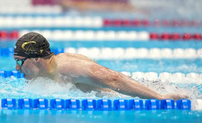 Thomas Heilman swims during the Men's 200 butterfly finals Wednesday, June 19, 2024, at the US Swimming Olympic Trials in Indianapolis. (AP Photo/Michael Conroy)