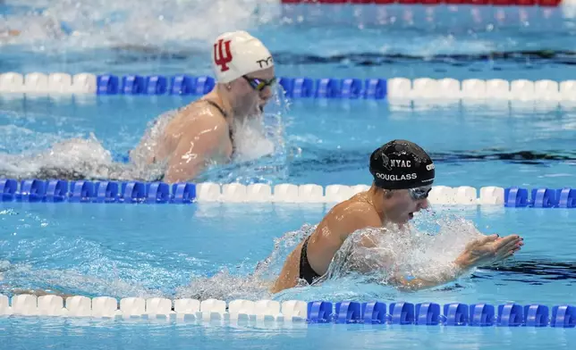 Kate Douglass swims during the Women's 200 breaststroke finals Thursday, June 20, 2024, at the US Swimming Olympic Trials in Indianapolis. (AP Photo/Michael Conroy)