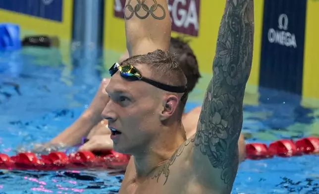 Caeleb Dressel reacts after winning the Men's 100 butterfly finals Saturday, June 22, 2024, at the US Swimming Olympic Trials in Indianapolis. (AP Photo/Darron Cummings)